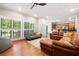 Open living room showcases hardwood floors, ample seating, and seamless access to the kitchen at 1770 Laurel Creek Dr, Lawrenceville, GA 30043