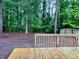 Backyard of home with wooden deck at 3045 Revere Cir, Snellville, GA 30039