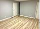 Spacious bedroom with wood-look flooring, neutral walls, and ample closet space at 3045 Revere Cir, Snellville, GA 30039