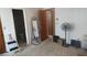 This bedroom contains a mirror, a fan, and an entrance to the bathroom at 335 Chase Woods Cir, Jonesboro, GA 30236