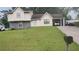 Charming two-story home with a stone accent, carport, and a well-maintained front lawn at 335 Chase Woods Cir, Jonesboro, GA 30236