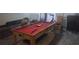 Basement game room featuring a pool table, lounge seating, and entertainment options at 335 Chase Woods Cir, Jonesboro, GA 30236