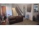 Open living space with a staircase, cozy seating, and an inviting atmosphere at 335 Chase Woods Cir, Jonesboro, GA 30236