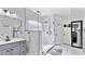 Elegant bathroom features a glass-enclosed shower, gray vanity, and neutral tones at 11440 Azalea Trl, Hampton, GA 30228
