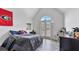Bright, charming bedroom with vaulted ceiling, complete with a cozy, personal touch at 11440 Azalea Trl, Hampton, GA 30228