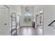 Bright foyer with soaring ceiling, decorative front door and chandelier, offering an elegant welcome at 11440 Azalea Trl, Hampton, GA 30228