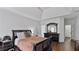 Comfortable main bedroom with hardwood floors, tray ceiling, and ample space for relaxation and furnishings at 11440 Azalea Trl, Hampton, GA 30228