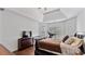 Spacious main bedroom with tray ceiling, hardwood floors, and plenty of natural light from the windows at 11440 Azalea Trl, Hampton, GA 30228