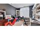 Office space with built in shelves, dark walls, and large windows letting in lots of light at 11440 Azalea Trl, Hampton, GA 30228