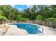 Inviting swimming pool with a spacious patio area, perfect for summer relaxation and recreation at 11440 Azalea Trl, Hampton, GA 30228