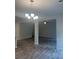Dining room with chandelier, hardwood floors, and white wainscoting at 1155 Park Center Cir, Austell, GA 30168