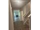 Hallway with view into living room with a fireplace and plenty of natural light at 1155 Park Center Cir, Austell, GA 30168