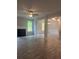 Open floor plan living room featuring a fireplace, hard surface floors, and plenty of natural light at 1155 Park Center Cir, Austell, GA 30168