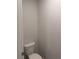 A standard white toilet in a small, simply designed powder room at 1155 Park Center Cir, Austell, GA 30168