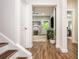 Basement entrance featuring hardwood floors with a view of rec room through the entrance at 2024 Towneship Trl, Roswell, GA 30075