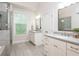 Bathroom featuring a walk-in shower, dual vanities, granite countertops, and ample cabinet space at 2024 Towneship Trl, Roswell, GA 30075