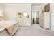 Spacious bedroom with a well-made bed, decorative furniture, and neutral tones that add sophistication at 2024 Towneship Trl, Roswell, GA 30075