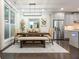Dining area featuring a wooden table with bench seating and neutral decor at 2024 Towneship Trl, Roswell, GA 30075