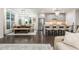 Open concept: Dining area next to the kitchen featuring counter seating and stainless steel appliances at 2024 Towneship Trl, Roswell, GA 30075