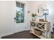 Cozy entryway featuring a stylish console table and decorative mirror at 2024 Towneship Trl, Roswell, GA 30075
