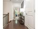 Second floor landing featuring hallway with shelving and natural light from window at 2024 Towneship Trl, Roswell, GA 30075