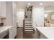 Hallway provides access to the staircase and features elegant finishes and ample natural light at 2024 Towneship Trl, Roswell, GA 30075