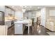 Bright, modern kitchen with island, stainless steel appliances, and elegant pendant lighting at 2024 Towneship Trl, Roswell, GA 30075