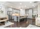 Open kitchen with gray cabinets, stainless steel appliances, and a center island with seating at 2024 Towneship Trl, Roswell, GA 30075