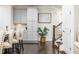 Kitchen with grey cabinets, stainless appliances, hardwood floors, and barstool seating at 2024 Towneship Trl, Roswell, GA 30075