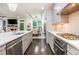 Bright kitchen with white countertops, stainless steel appliances, and hardwood floors at 2024 Towneship Trl, Roswell, GA 30075