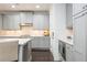 Well-lit kitchen with sleek cabinets, stainless steel appliances, and modern finishes at 2024 Towneship Trl, Roswell, GA 30075