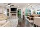 Open living space with fireplace, television, access to back porch and dining area at 2024 Towneship Trl, Roswell, GA 30075