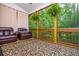 Relaxing screened porch with comfortable seating and peaceful wooded views, great for outdoor living at 2024 Towneship Trl, Roswell, GA 30075