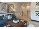 Cozy finished basement featuring a plush sofa, playful artwork, and warm lighting for a comfortable retreat at 210 Mooney Rd, Woodstock, GA 30188