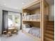 bedroom with built-in bunk beds, adjacent stools and a large window at 210 Mooney Rd, Woodstock, GA 30188