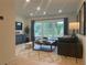 Comfortable living room with large windows and a neutral color palette at 210 Mooney Rd, Woodstock, GA 30188