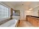 Spacious bathroom features double vanity, granite countertop, shower, and large soaking tub at 375 Causeway Ct, Suwanee, GA 30024