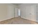 Bedroom with carpet flooring, closet space and an entryway leading to another room at 375 Causeway Ct, Suwanee, GA 30024