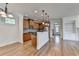 Bright kitchen featuring stainless steel appliances, granite countertops, and hardwood floors at 375 Causeway Ct, Suwanee, GA 30024
