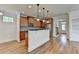 Bright kitchen featuring stainless steel appliances, granite countertops, and hardwood floors at 375 Causeway Ct, Suwanee, GA 30024