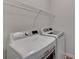 A modern laundry room features a new washer and dryer at 375 Causeway Ct, Suwanee, GA 30024
