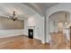 Living room featuring hardwood floors, a fireplace, and a statement chandelier at 375 Causeway Ct, Suwanee, GA 30024