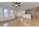 Open-concept living room features hardwood floors and is connected to the modern kitchen space at 375 Causeway Ct, Suwanee, GA 30024