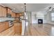 Open-concept living space with a fireplace and built-in shelving at 375 Causeway Ct, Suwanee, GA 30024