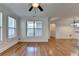 Spacious living room featuring hardwood floors flowing into the kitchen area at 375 Causeway Ct, Suwanee, GA 30024