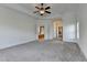 Main bedroom with an open entrance to an ensuite bathroom with a soaking tub and glass enclosed shower at 375 Causeway Ct, Suwanee, GA 30024