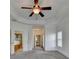 Main bedroom with an open entrance to an ensuite bathroom with a soaking tub and glass enclosed shower at 375 Causeway Ct, Suwanee, GA 30024