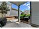 A backyard offers a concrete patio, manicured shrubs, and a well-kept lawn at 375 Causeway Ct, Suwanee, GA 30024