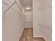 A spacious walk-in closet boasts ample shelving and storage options at 375 Causeway Ct, Suwanee, GA 30024