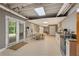 Open basement with a kitchen area, dining space, and convenient access to the outdoors through glass doors at 420 Windswept Ct, Roswell, GA 30075